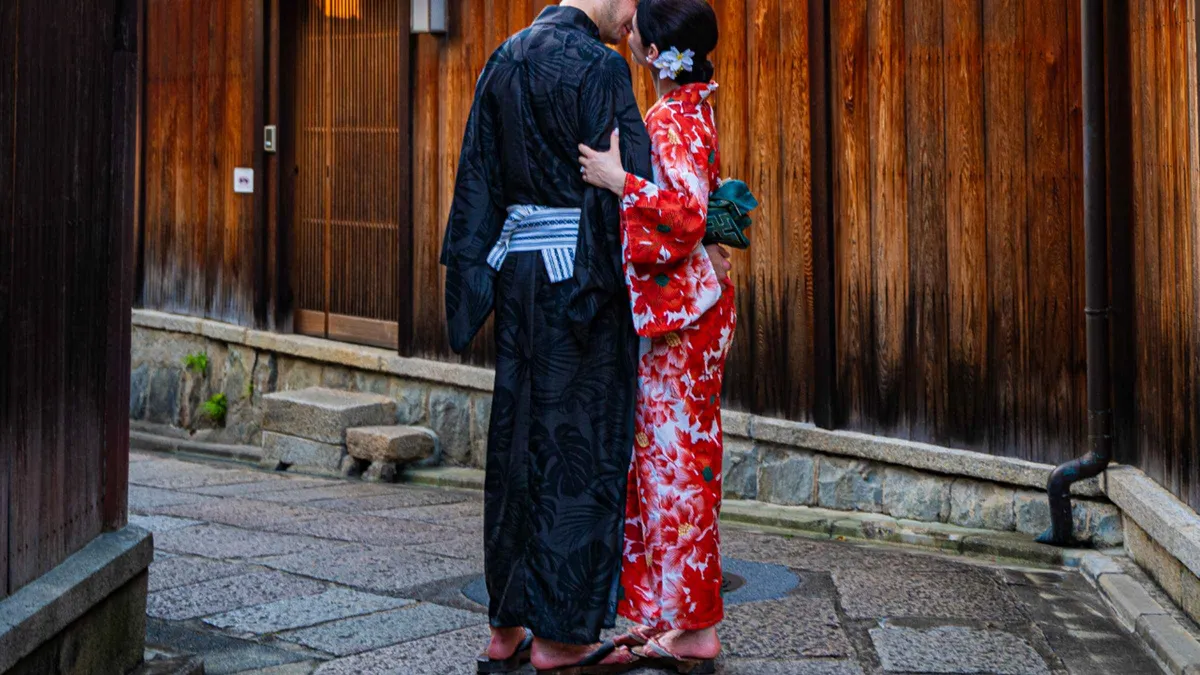 Couple in traditional kimono strolling a historic street during a private kimono Kyoto photoshoot, Kyoto